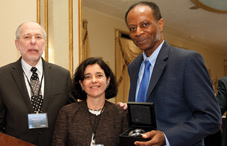 Dr. Donald N. Bersoff, APA’s president (left), and Dr. Celiane Rey-Casserly, chair of APA’s Board of Educational Affairs (middle), present Caleb Gilchrist with a Friends of Psychology Distinguished Service Award.