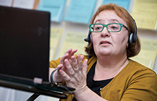 Cambridge College faculty member Dr. Elena Cherepanov conducts psychological first-aid training via Skype with mental health professionals and students in Ukraine. credit: Evan Richman