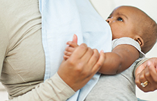 Babies who are breastfed for at least a year may be smarter and richer as adults.
