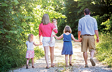 Dr. Lyndsay N. Jenkins and her husband, Jackson, divvy up child care to maintain balance. Lyndsay gets their three children— Reghan, Reese and Raelyn—off to school while Jackson picks them up each day and starts dinner.