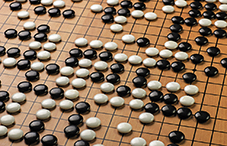 An artificial intelligence system outperforms humans when playing the ancient strategy game Go.
