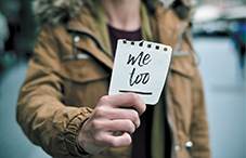 Woman holding #metoo note