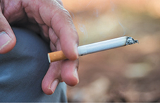 Hand holding cigarette