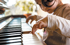 Child playing piano