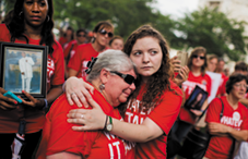 Ashley Cech, right, whose mother survived the Sandy Hook Elementary School shootings, comforts Diane Sellgren, whose daughter died by suicide with a gun, during a gun-control rally in Washington, D.C., hosted by Everytown for Gun Safety in 2015.