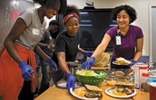 Teens at Terra Firma prepare and eat a meal together with a dietitian before group therapy.