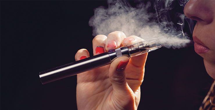 Person using a vaping device