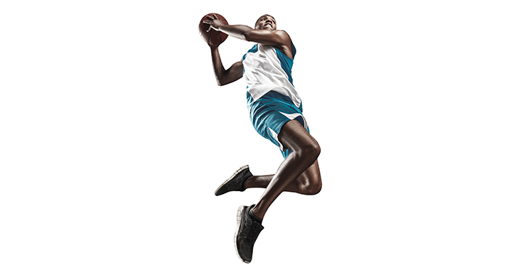 Basketball player going up to take a shot