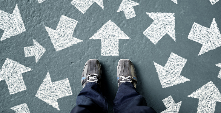 Feet surrounded by directional arrows pointing in different directions