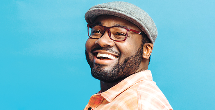 African American man gleefully laughing 