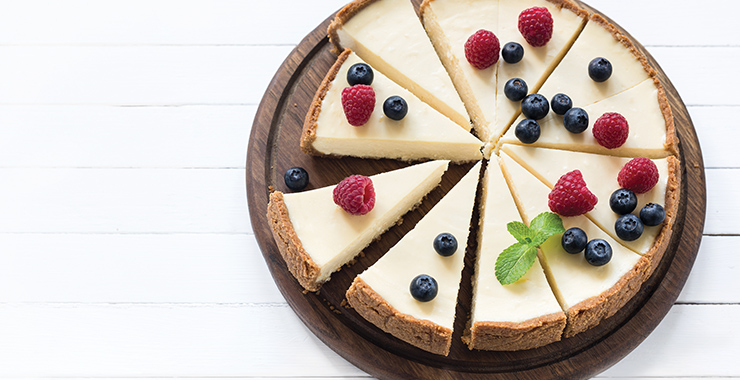 Cheese cake slices with berries on top.