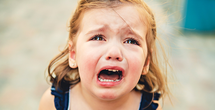 Young girl crying.