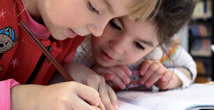 Young children coloring.