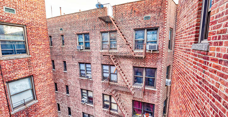 Monitor on Psychology: June; brick apartment building