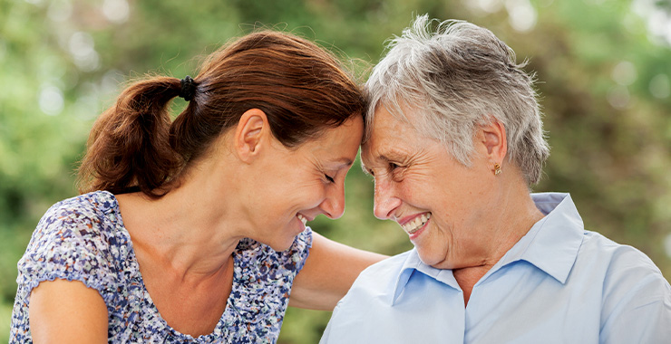 Adult child and elderly parent interacting