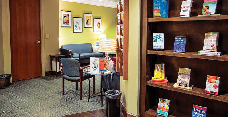 Pleasant office space with a table, chairs and bookshelf