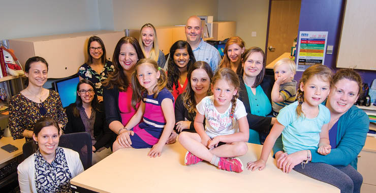 Dr. Christine Chambers with lab members and research participants.