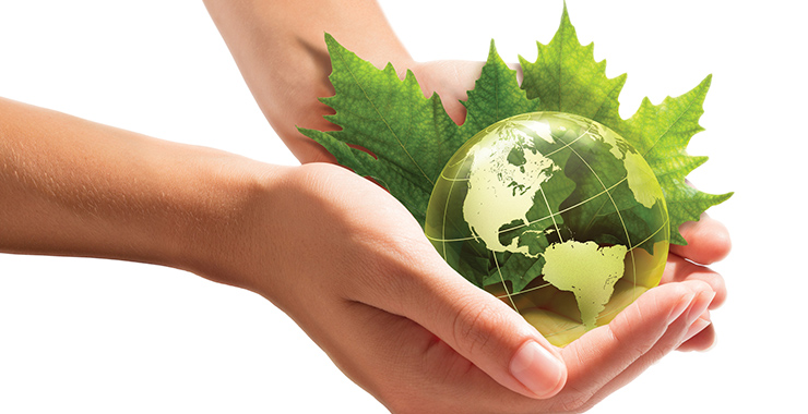 Woman holding representation of the world in her hands