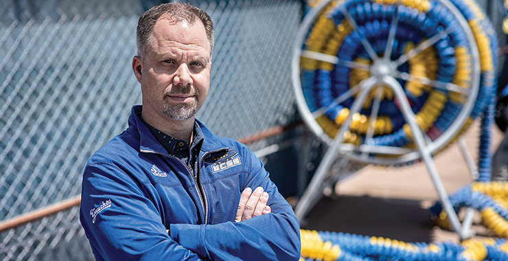 Dr. Dave Botsford on a collegiate swimming deck