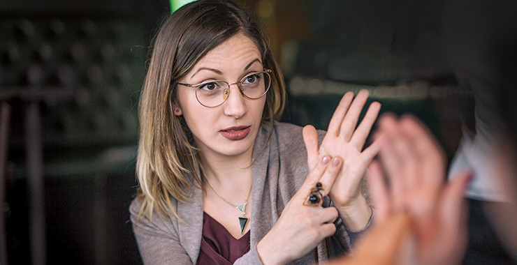 Woman signing to someone 