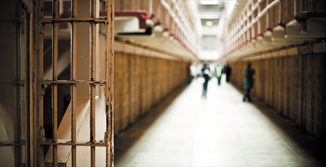prison cell block with inmates