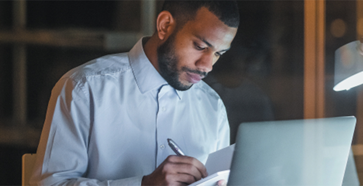 young man in front of his laptop