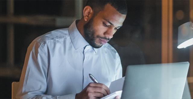 young man in front of his laptop