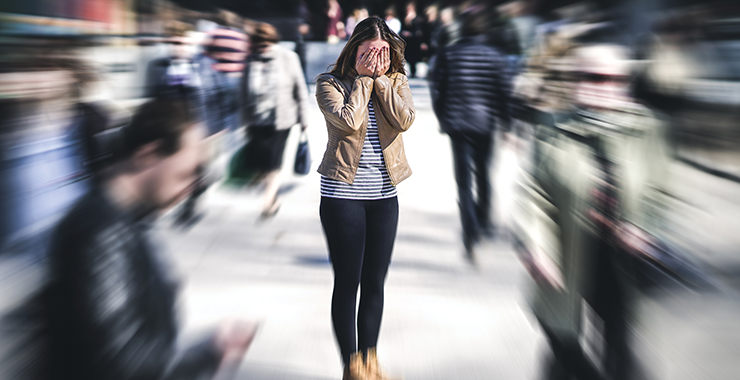 overwhelmed woman with hands over her face