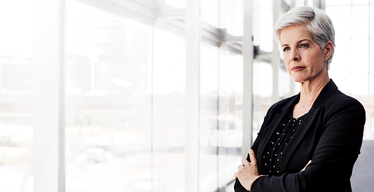 confident professional woman with arms crossed