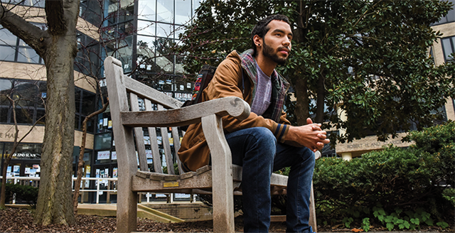 college student on a bench