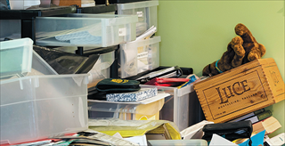 disorganized piles of office papers and books