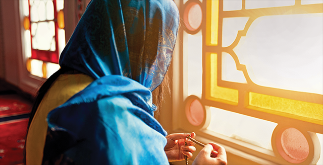 woman with headscarf in prayer