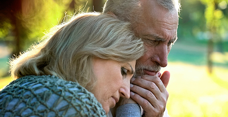 Older couple in close embrace
