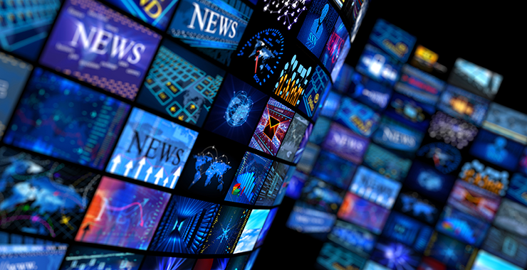 wall of news outlet monitor screens