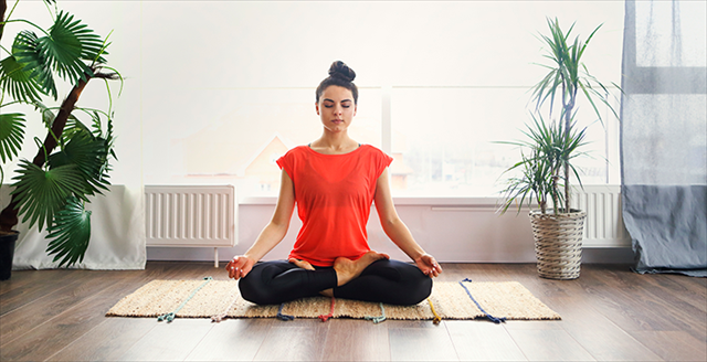Woman in yoga pose meditating