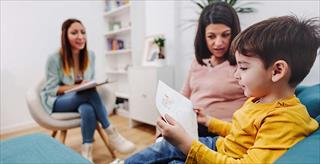 mother, child, and professional in a therapy setting