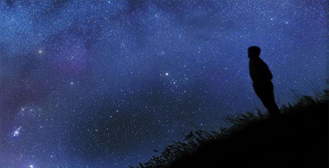 figure looking at starry sky