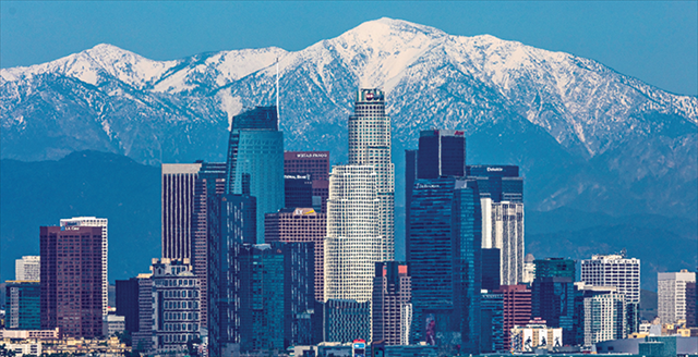 city skyline with unobstructed view of mountains