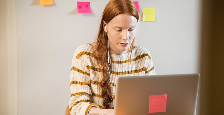 woman working in front of a laptop