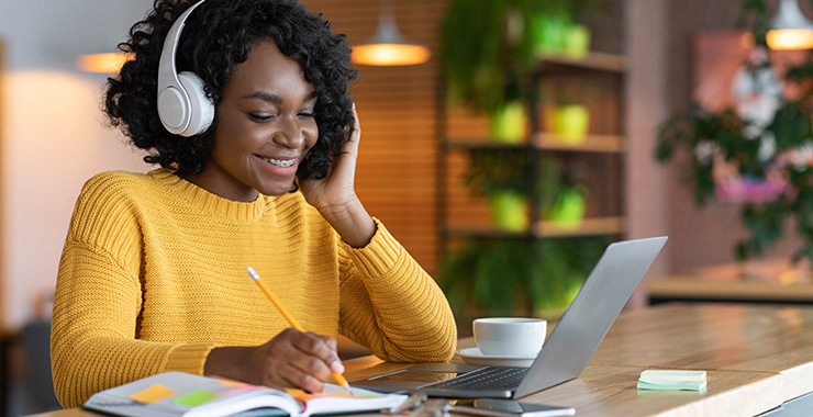student enjoying wearing headphones