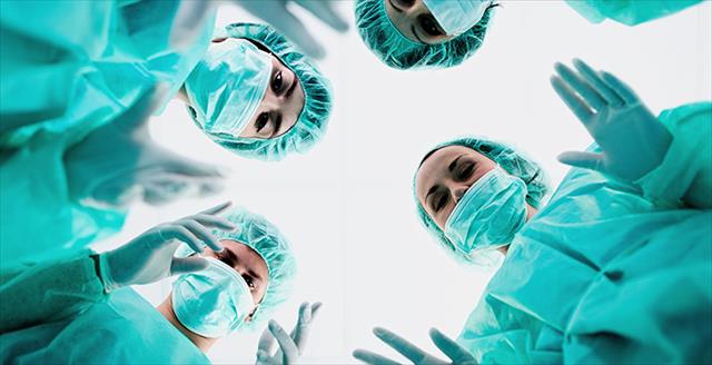 group of people wearing medical scrubs