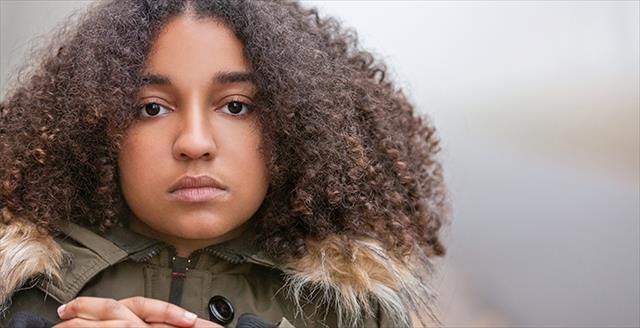 young girl with serious expression