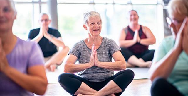 older people doing yoga