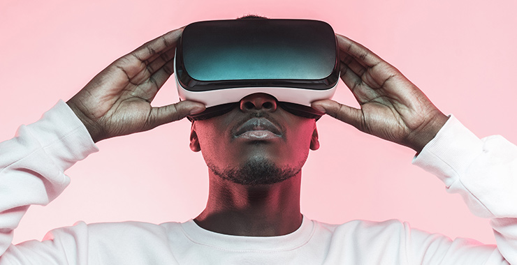 young man using virtual reality glasses