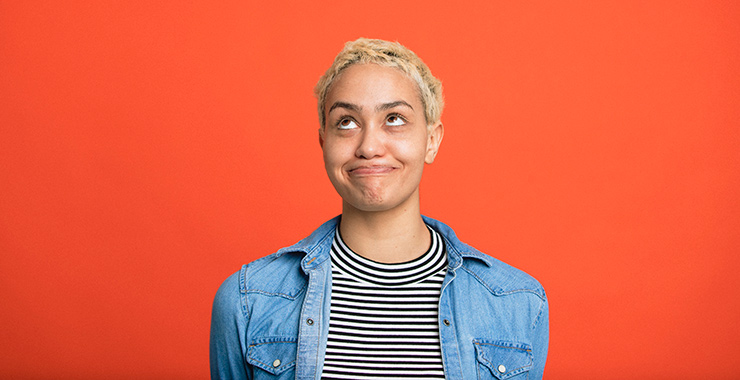 woman looking amused as she turns her head to look up