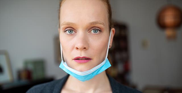 woman with her non medical masked pulled down under her chin