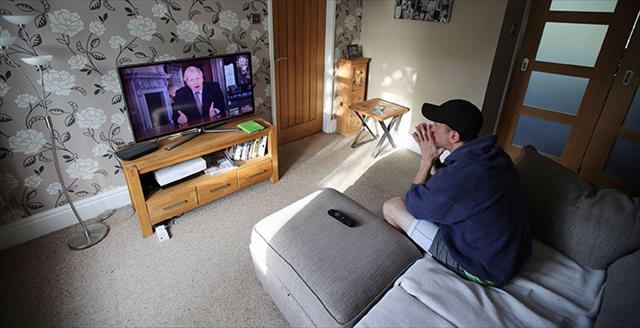 man watching television