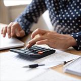 woman using a small handheld calculator