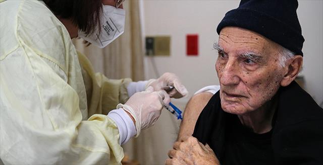 older man receiving a shot
