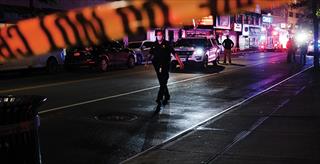 law enforcement officer walking down the street